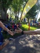 Triathlete version of the Sistine Chapel, high fiving a teammate before I cross the finish line.